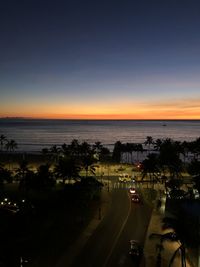 High angle view of road by sea against sky during sunset