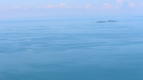 Scenic view of calm sea against blue sky
