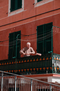 Portrait of man against building