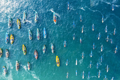 High angle view of people swimming in sea