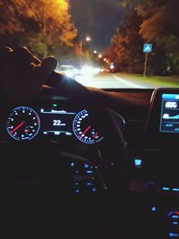 View of vehicles on road at night