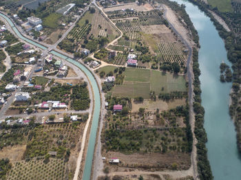 High angle view of city buildings by sea