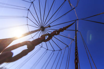 Low angle view of amusement park ride against sky