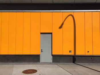 Shadow of street light on building wall