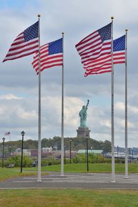 American flag against statue of liberty