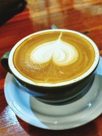 Close-up of cappuccino on table