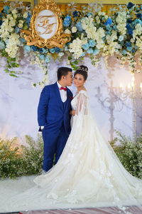 Young couple holding flower bouquet