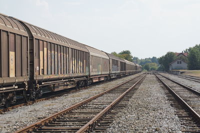 Train on railroad tracks against sky