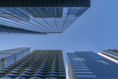 Low angle view of modern buildings against sky