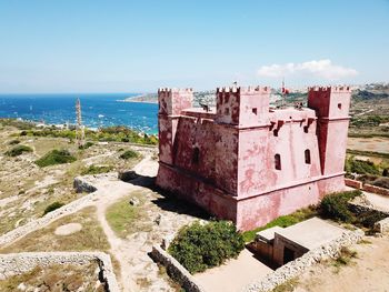 Red tower in a clear blue sky 