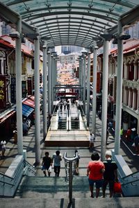 Rear view of people walking in shopping mall