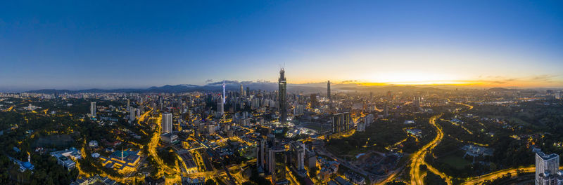 High angle view of buildings in city against clear sky