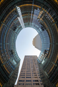 Low angle view of modern buildings against clear sky