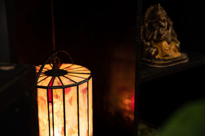 Close-up of illuminated lamp at home