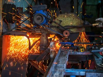 Low angle view of illuminated machinery
