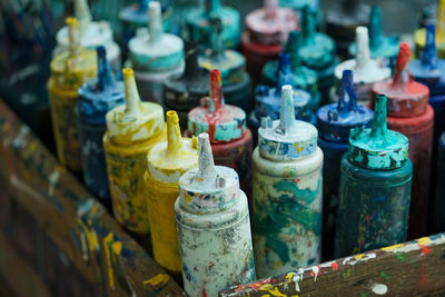 Close-up of various bottles in shelf at market