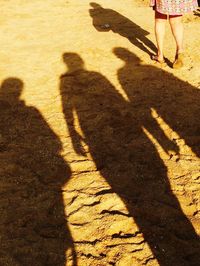 Shadow of people on sand