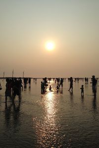 People on sea during sunset