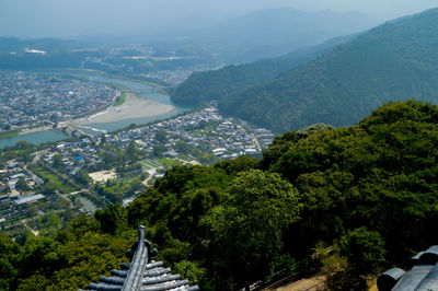 High angle view of trees and mountains against sky