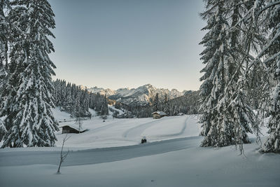 Scenic view of snow covered mountains against sky