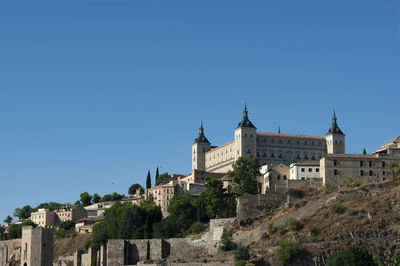 Low angle view of buildings against blue sky