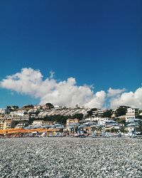 Buildings against blue sky and clouds