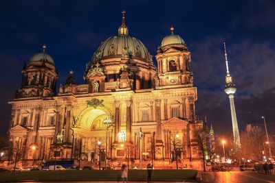 Berlin cathedral against sky in city at night
