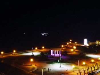 High angle view of illuminated street at night