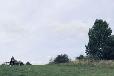 Man on field against sky