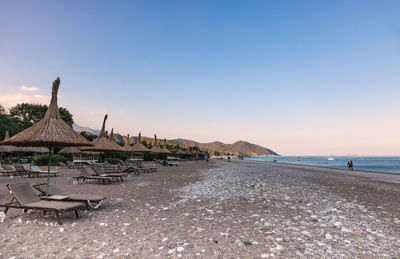 Scenic view of beach against clear sky