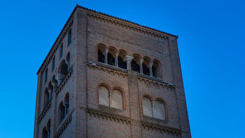 Mantua cathedral tower - low angle view of historical building against clear blue sky