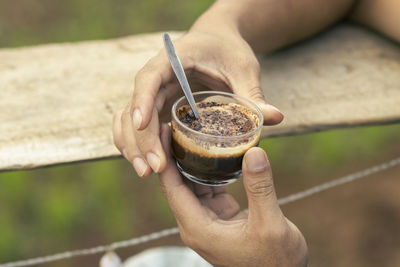 Close-up of hand holding drink