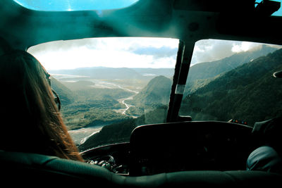 Scenic view of mountains seen through airplane window