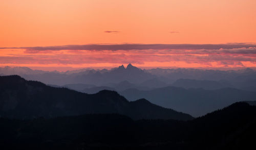 Scenic view of silhouette mountains against sky during sunset