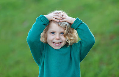 Portrait of cute girl standing outdoors