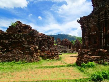 View of old ruin building against cloudy sky