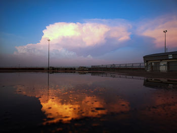 Scenic view of lake against sky at sunset
