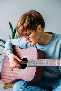 Young man playing guitar