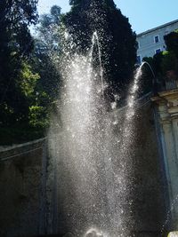 Low angle view of fountain against sky