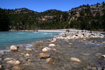 Scenic view of sea with mountain in background