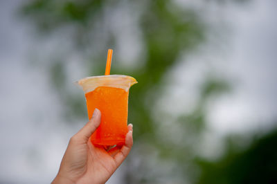 Close-up of hand holding ice cream