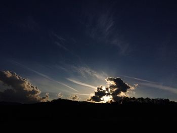 Silhouette landscape against sky during sunset