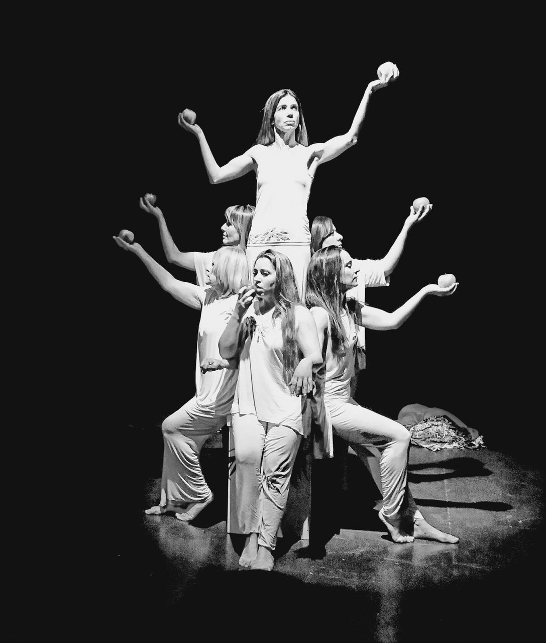 full length, human arm, arts culture and entertainment, performance, front view, people, limb, two people, stage - performance space, black background, indoors, stage, women, arms outstretched, studio shot, sitting, young adult, dancing, young men, adult, arms raised, human limb