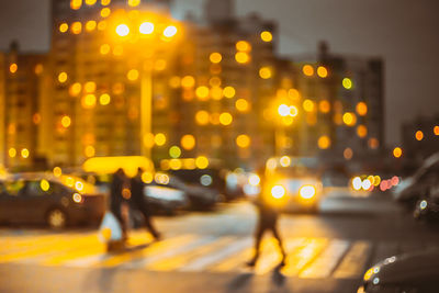 Illuminated city street at night