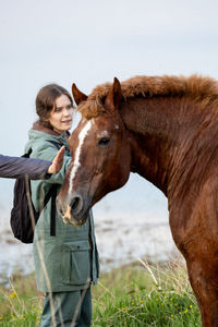 Horse standing on field