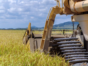 Combines harvester harvesting rice on a bright day, in north of brazil