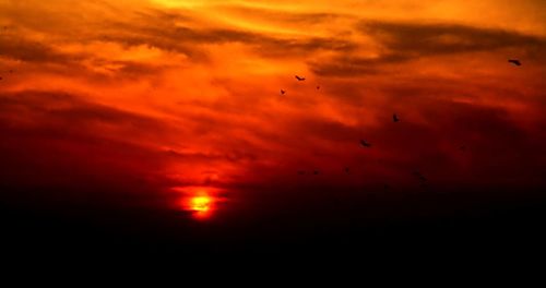 Scenic view of dramatic sky during sunset