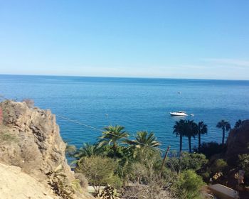 Scenic view of sea against clear blue sky