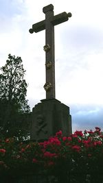 Low angle view of statue against sky