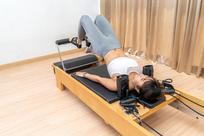 High angle view of woman lying down on floor